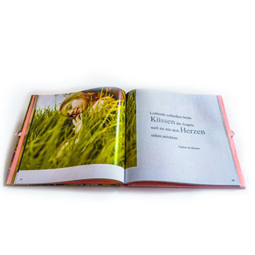 Quality assured custom hardcover art photobook with ribbon