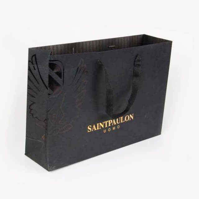 Luxury shopping paper bag with the gold foil stamped logo